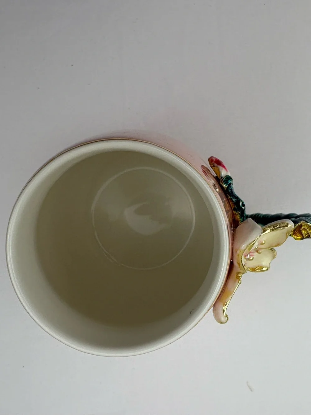 Pink ceramic enamel mug decorated with a 3D floral, rhinestones, and gold trim.